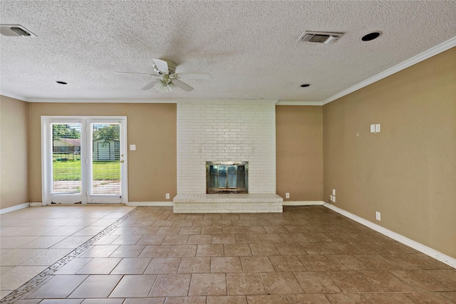 unfurnished living room with a brick fireplace, a textured ceiling, ceiling fan, crown molding, and light tile patterned floors