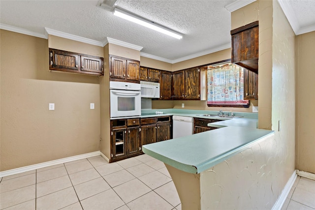 kitchen featuring sink, crown molding, white appliances, and kitchen peninsula