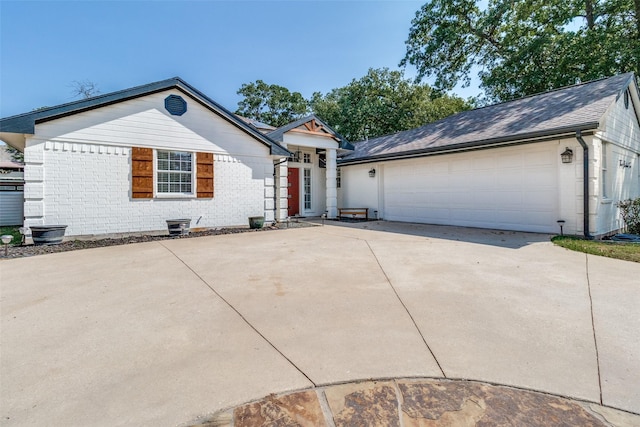 ranch-style home featuring a garage