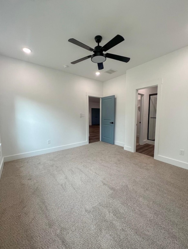 unfurnished bedroom with ceiling fan and carpet