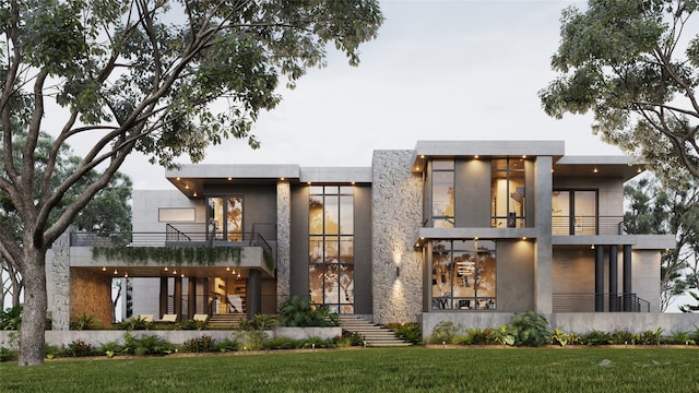 back of house with a lawn and a balcony