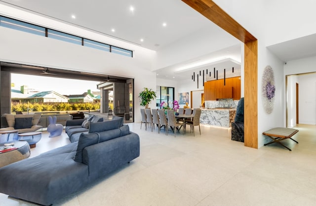 living room with a towering ceiling