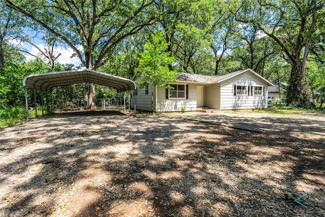 ranch-style house with a carport