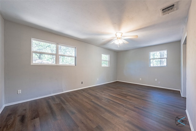 spare room featuring dark hardwood / wood-style floors and ceiling fan