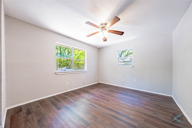 empty room featuring dark hardwood / wood-style floors and ceiling fan