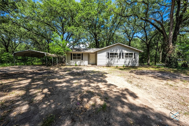 ranch-style home with a carport