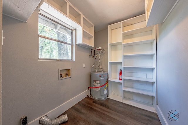 interior space featuring dark hardwood / wood-style floors, water heater, and washer hookup