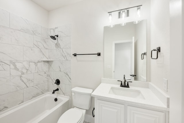 full bathroom with vanity, toilet, and tiled shower / bath combo