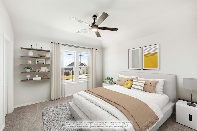 carpeted bedroom featuring vaulted ceiling and ceiling fan