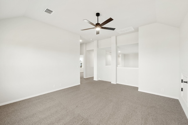 carpeted spare room featuring ceiling fan and lofted ceiling