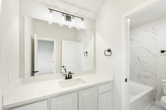 full bathroom with tiled shower / bath combo, vanity, and toilet