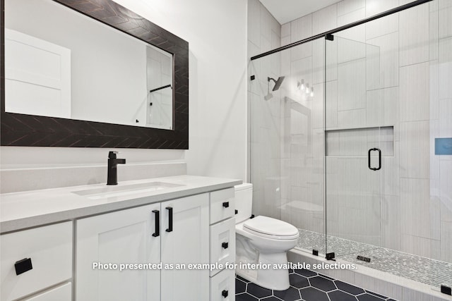 bathroom with vanity, toilet, and walk in shower