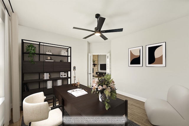 home office with hardwood / wood-style flooring and ceiling fan