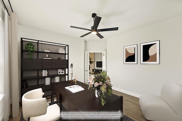 home office with baseboards, ceiling fan, and wood finished floors