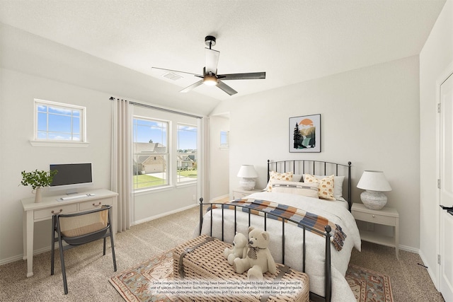 bedroom featuring light carpet, multiple windows, a textured ceiling, and ceiling fan