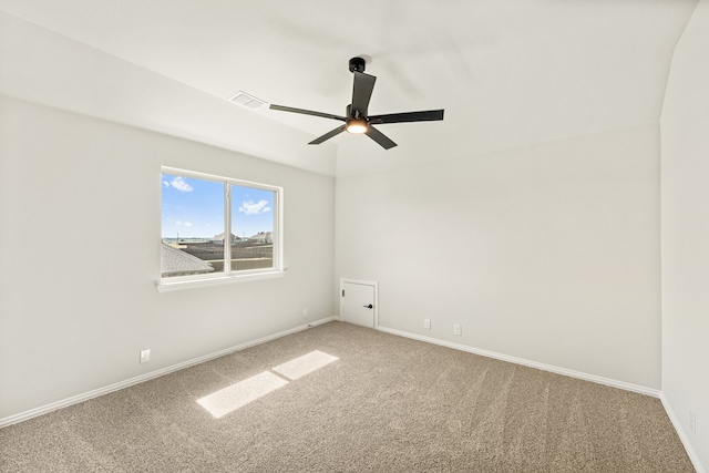 unfurnished room featuring ceiling fan and carpet flooring