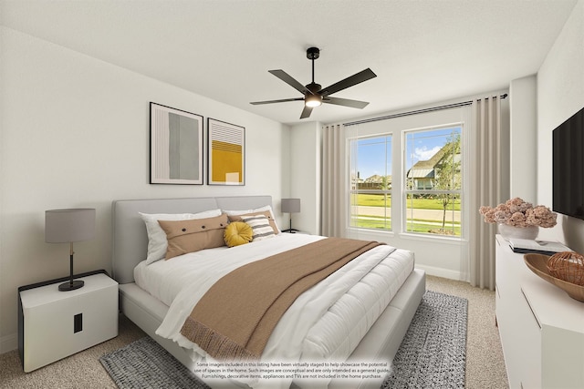 bedroom featuring light colored carpet and ceiling fan