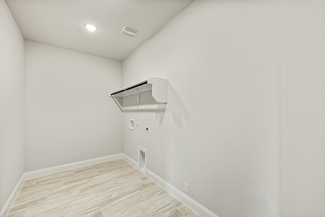 laundry room featuring hookup for a gas dryer, hookup for a washing machine, electric dryer hookup, and light wood-type flooring