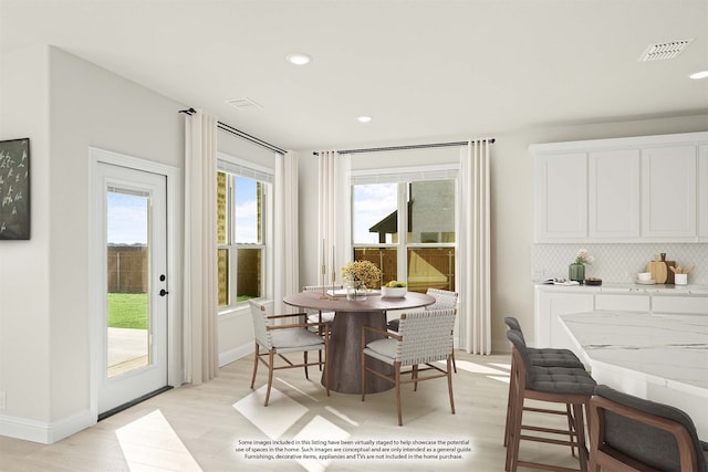 dining area with light hardwood / wood-style floors