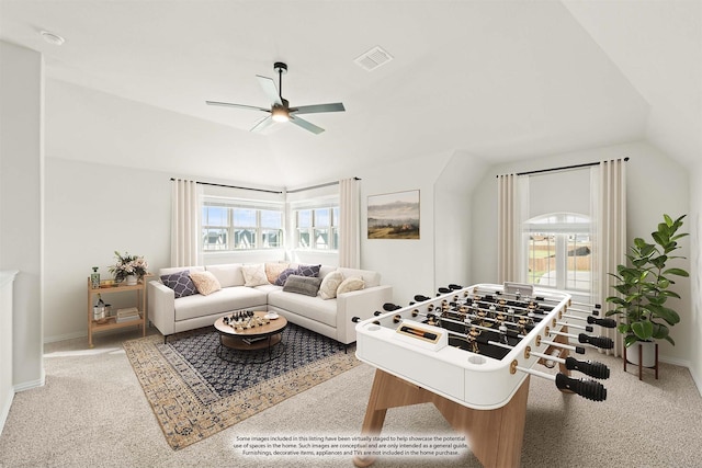recreation room with a healthy amount of sunlight, a ceiling fan, vaulted ceiling, and visible vents