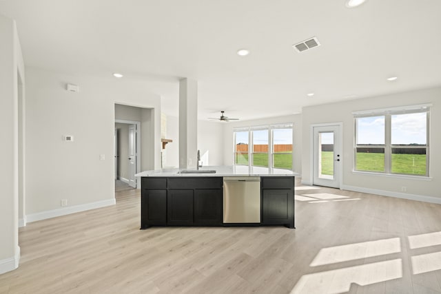 kitchen featuring a wealth of natural light, dishwasher, and light wood-type flooring