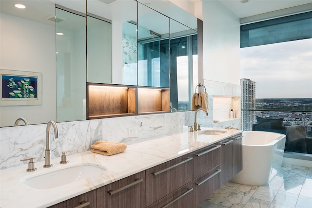 bathroom with vanity and independent shower and bath