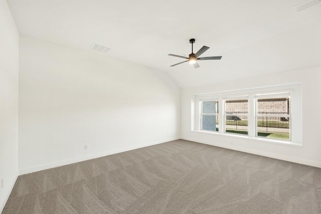 unfurnished room featuring light carpet, ceiling fan, and lofted ceiling