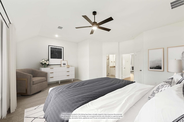 carpeted bedroom featuring connected bathroom, ceiling fan, and lofted ceiling