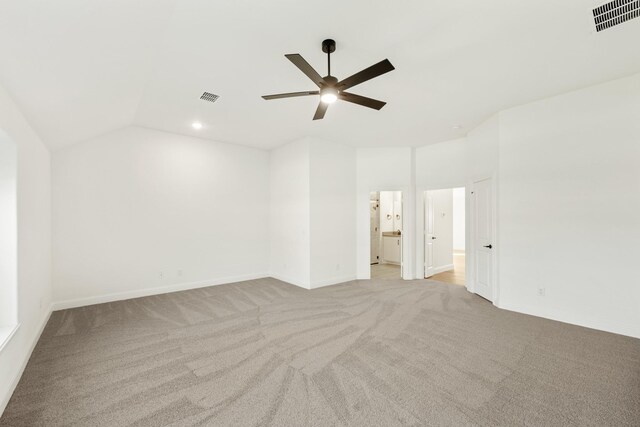 unfurnished room with ceiling fan, light carpet, and lofted ceiling