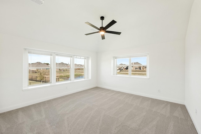 spare room with light carpet and ceiling fan