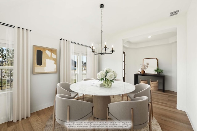 2500 Fischer Ln, Mansfield, TX 76063 - dining space featuring hardwood / wood-style flooring and a chandelier