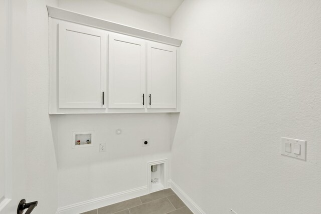 laundry area with electric dryer hookup, cabinets, tile patterned floors, hookup for a gas dryer, and hookup for a washing machine