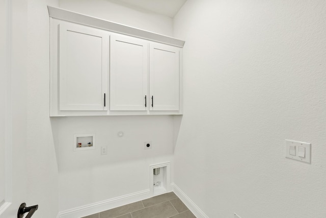 2500 Fischer Ln, Mansfield, TX 76063 - washroom with hookup for a gas dryer, tile patterned flooring, cabinets, hookup for a washing machine, and electric dryer hookup