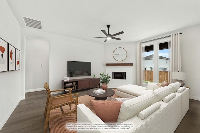 living room with ceiling fan and dark hardwood / wood-style floors