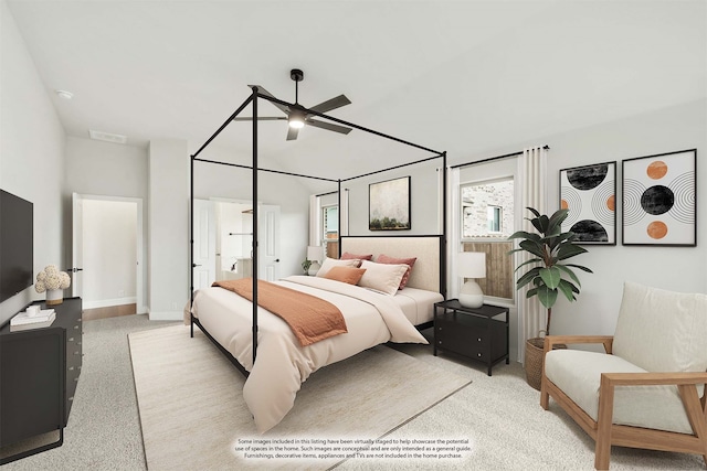 bedroom featuring light carpet and ceiling fan