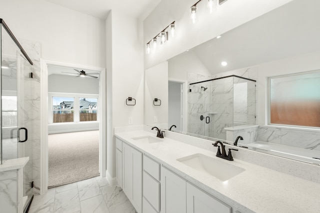 bathroom featuring vanity, vaulted ceiling, ceiling fan, and a shower with shower door