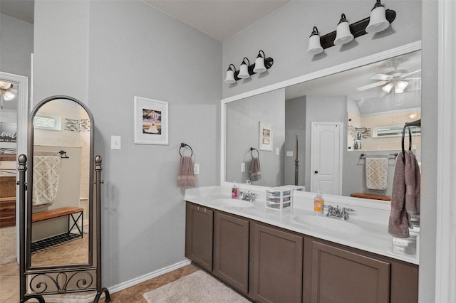 bathroom featuring tile patterned flooring, ceiling fan, and vanity