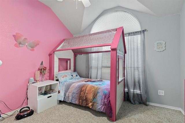 bedroom featuring light colored carpet, vaulted ceiling, and ceiling fan