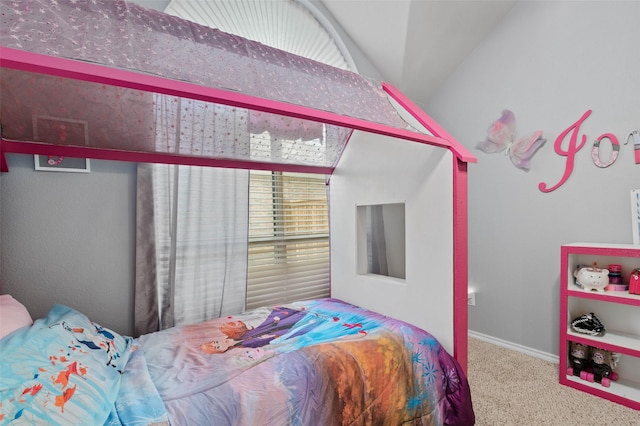 bedroom with carpet flooring and lofted ceiling