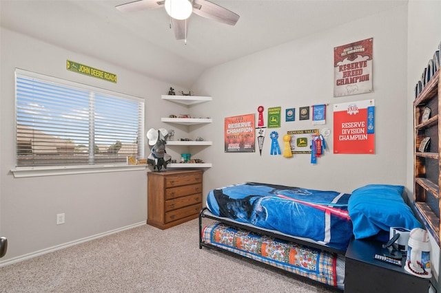 bedroom with carpet flooring, ceiling fan, and vaulted ceiling