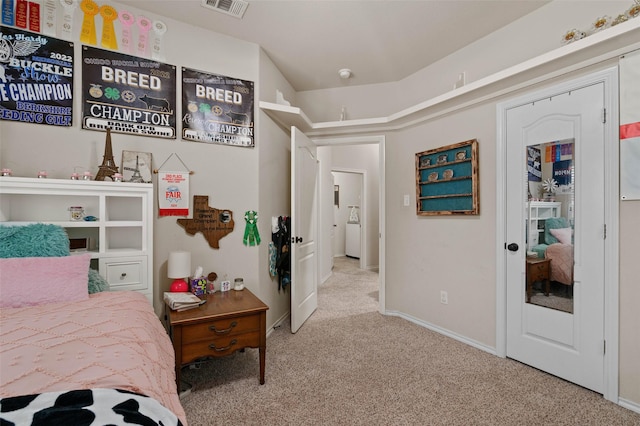 bedroom with light colored carpet