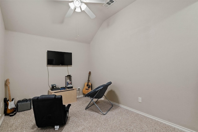 workout area featuring light colored carpet, ceiling fan, and lofted ceiling