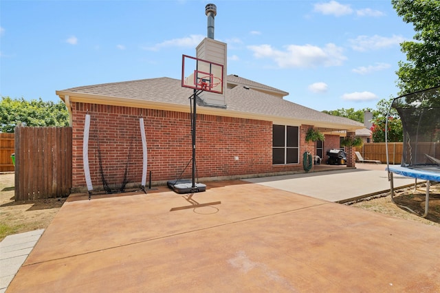 view of basketball court featuring a trampoline