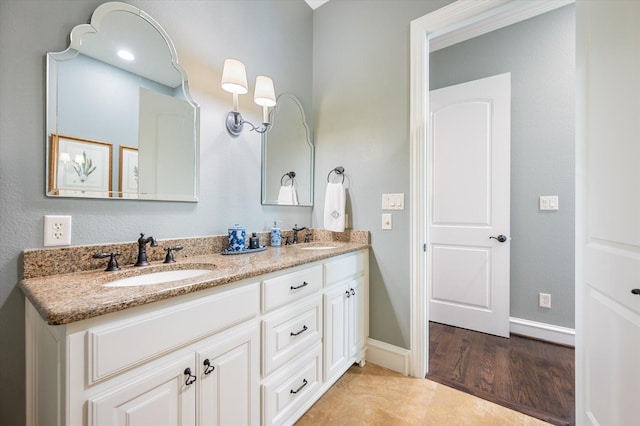 bathroom with vanity and tile patterned flooring