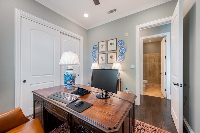 office featuring dark hardwood / wood-style floors, ceiling fan, and ornamental molding