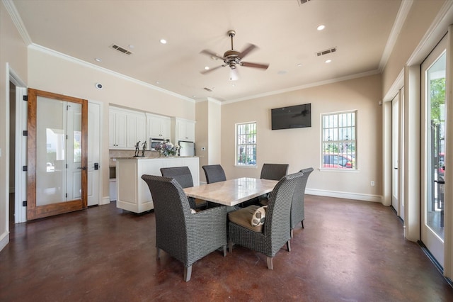 dining space featuring ceiling fan, a healthy amount of sunlight, and ornamental molding