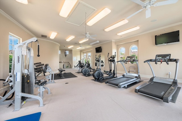 workout area featuring ceiling fan, carpet floors, and crown molding