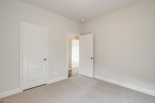 unfurnished room featuring carpet flooring