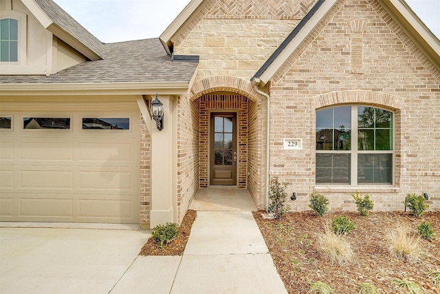 view of exterior entry featuring a garage