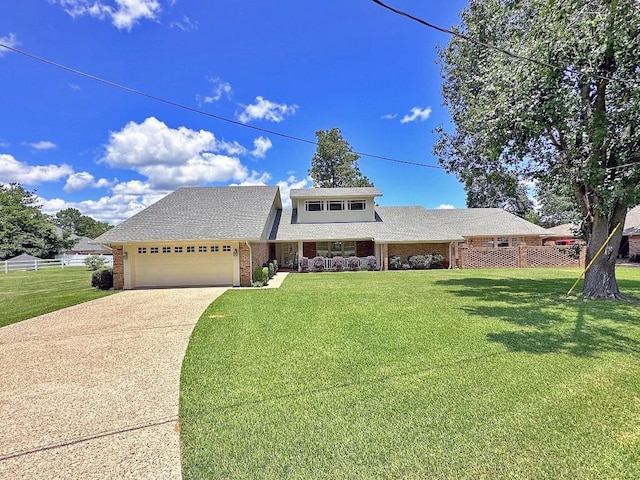 view of front property featuring a front yard and a garage